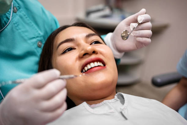 a patient during a dental exam