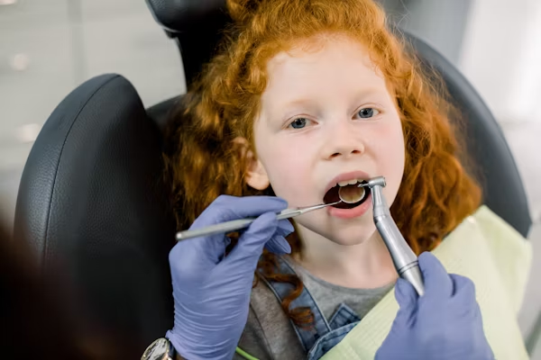 a little kid during a dental exam